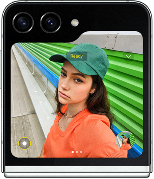 close up of the cover screen of the Galaxy Z Flip5 showcasing the two back cameras and screen overlay of a woman taking a selfie