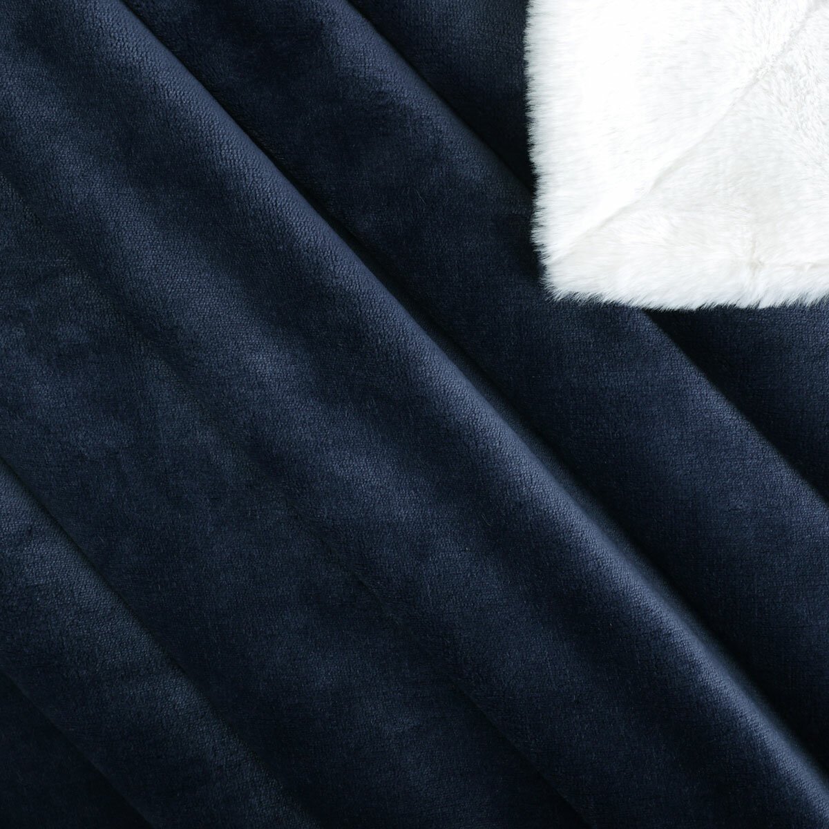 Detail of Navy ridged blanket with white sherpa lining