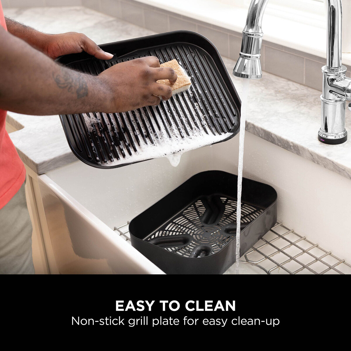 Lifestyle image of non stick grill plate being cleanedimages Lifestyle image of non stick grill plate being cleanedimages