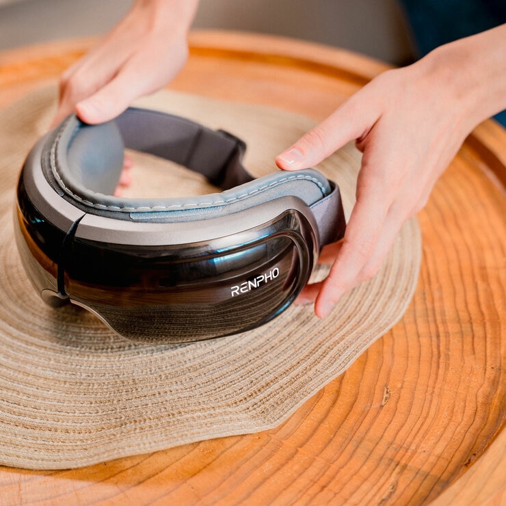 Lifestyle image of Renpho Artimis Blush Light Mask on a table