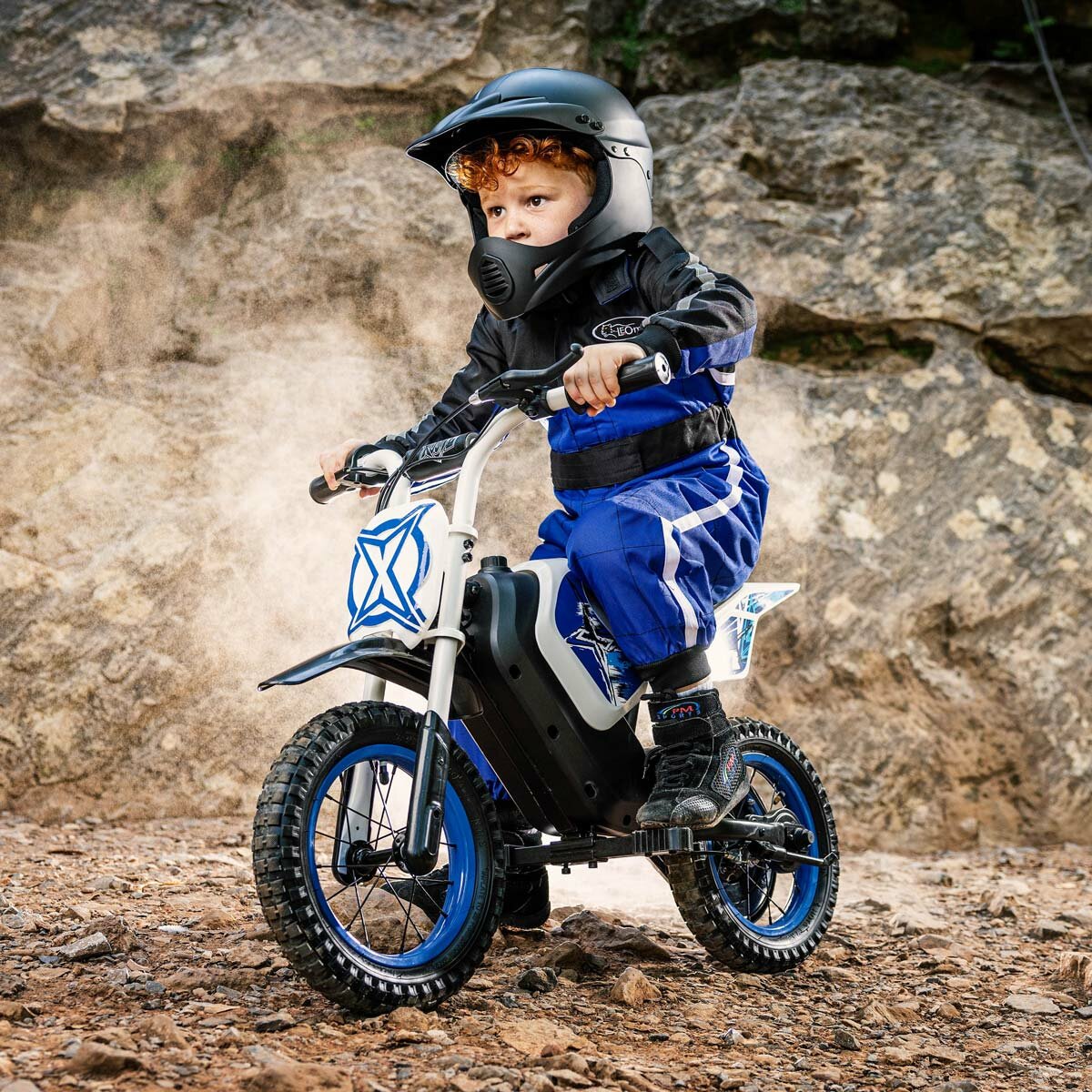 Lifestyle image of a child riding the Xootz Cobolt Kids Electric Motorbike