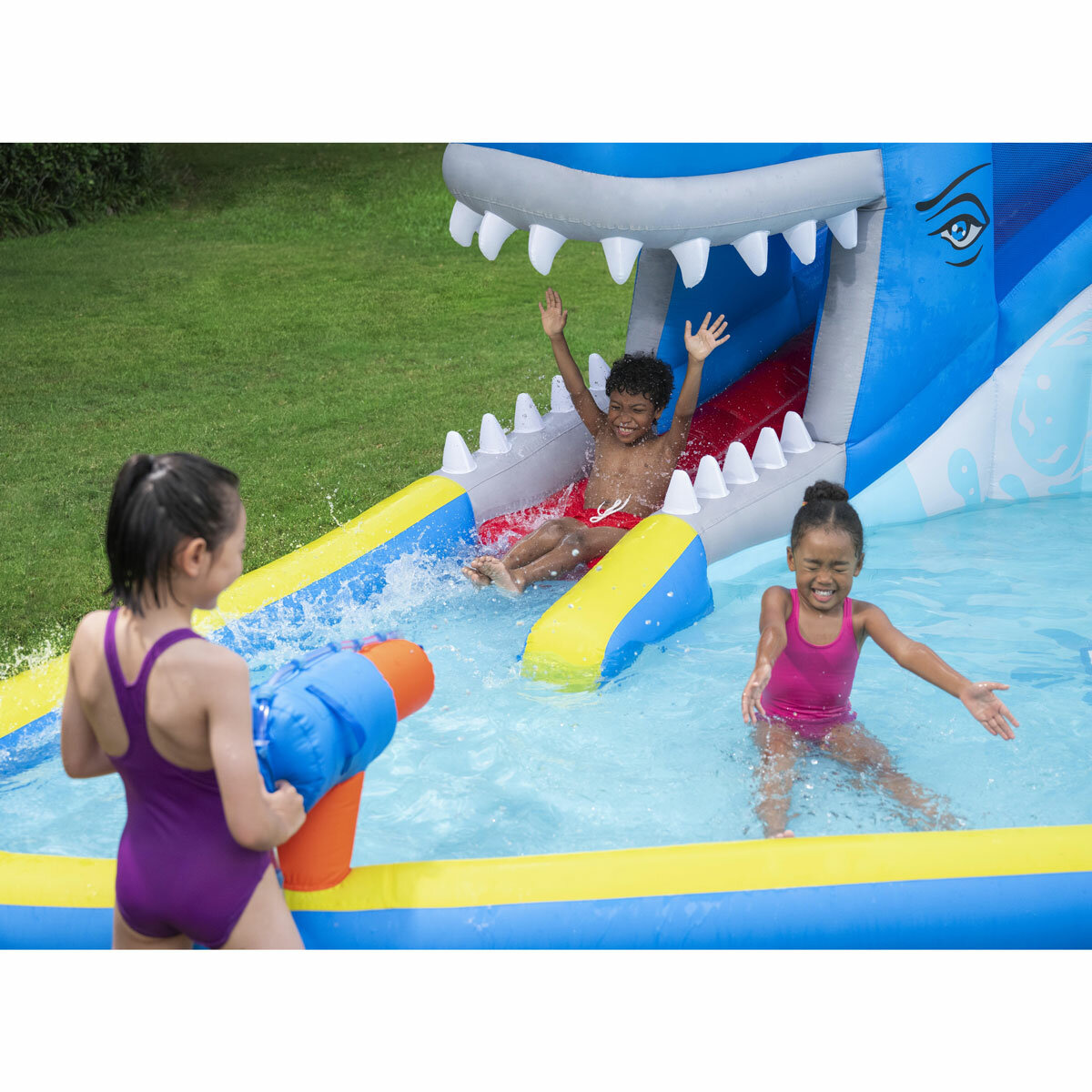 Lifestyle image of a child spraying other children with the water cannon