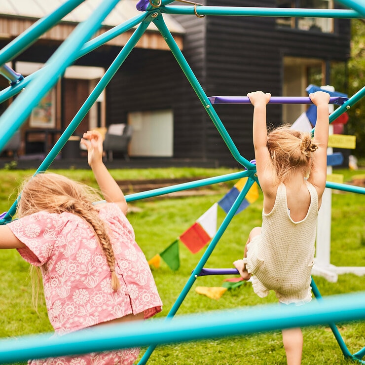 Lifestyle image showing children climbing the dome