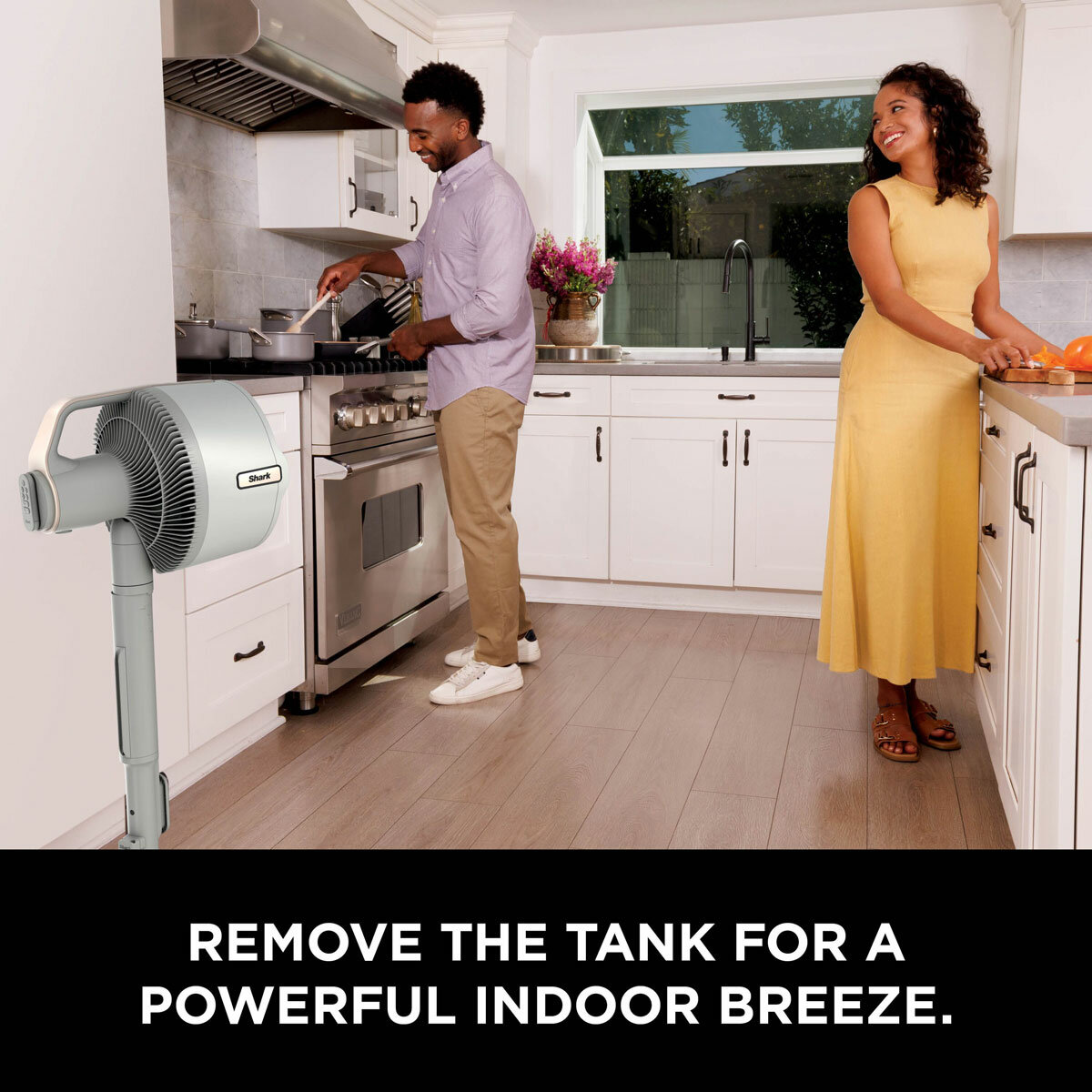 Lifestyle image of  Shark FlexBreeze Pro Mist Indoor & Outdoor Fan & Outdoor Misting System used in the kitchen