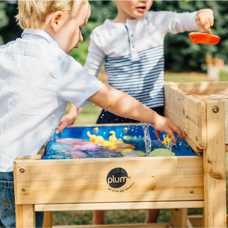 Lifestyle image of a child playing with the water table Lifestyle image of a child playing with the water table