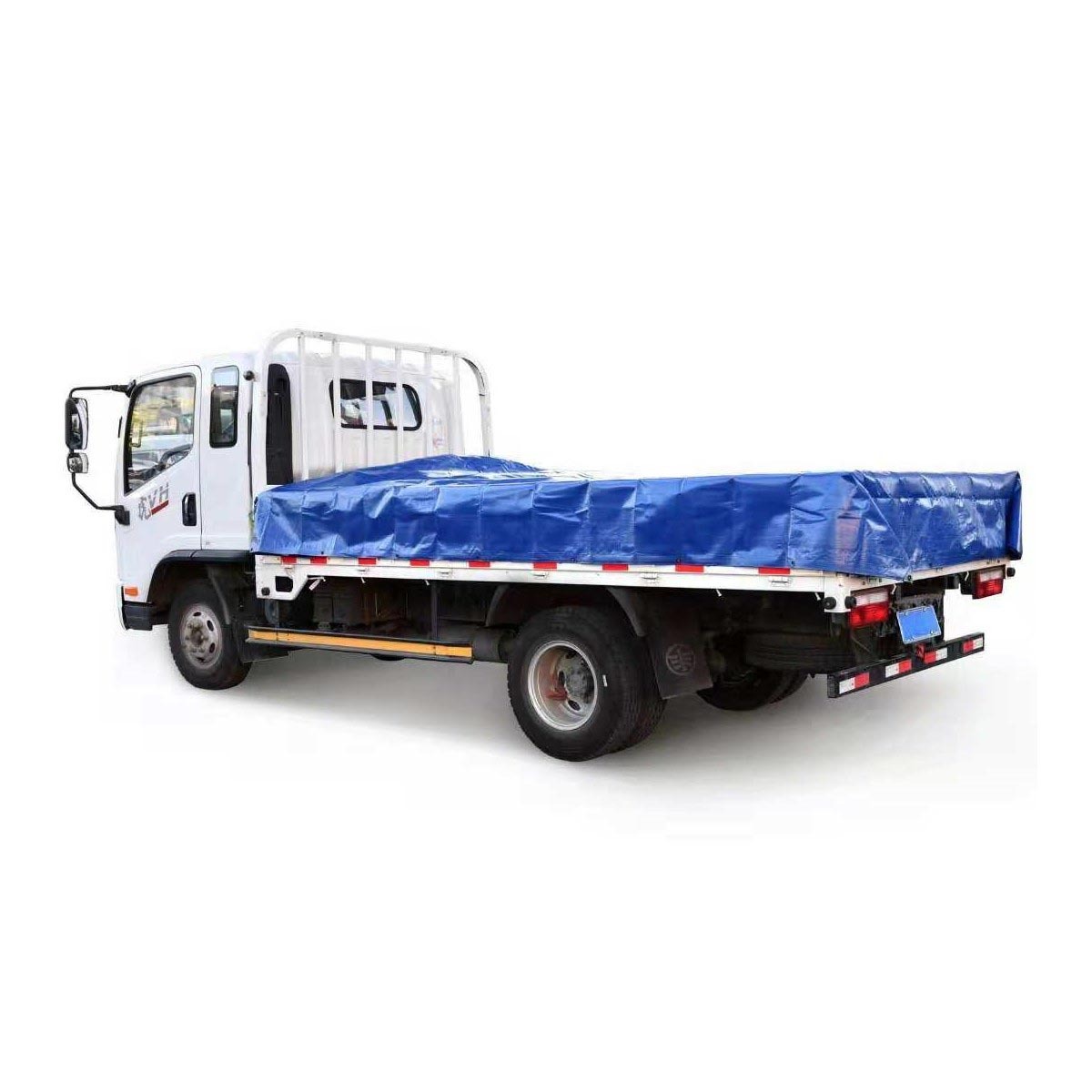 Cut out image of tarp being used on truck on white background