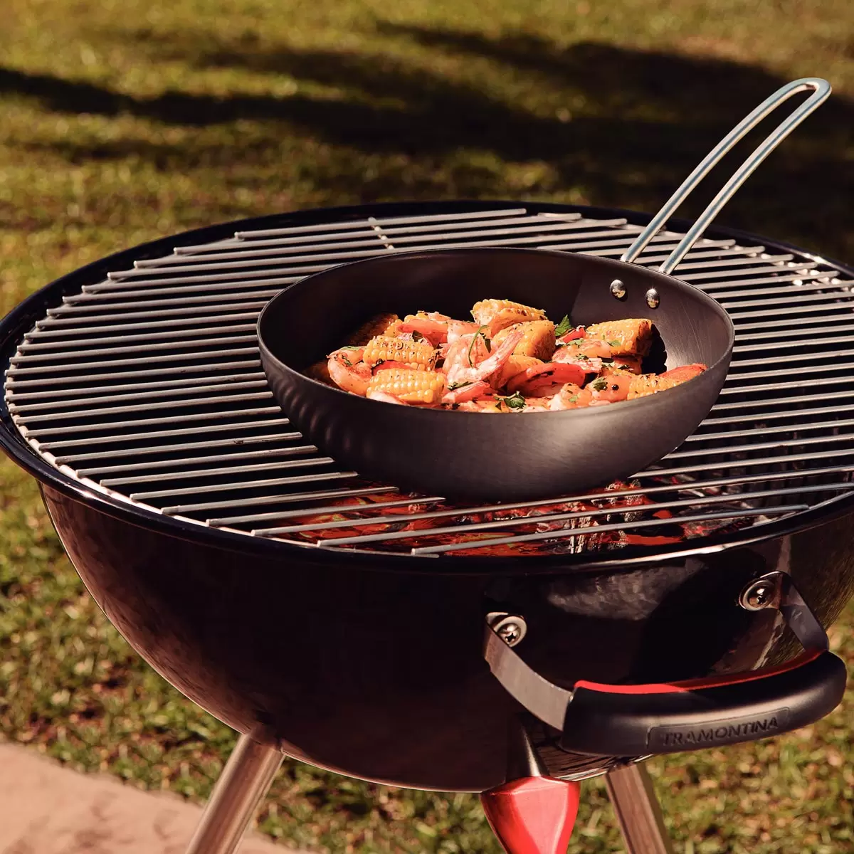 Lifestyle image of wok on BBQ