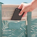 Lifestyle image of someone putting their phone into the zip pocket Lifestyle image of someone putting their phone into the zip pocket