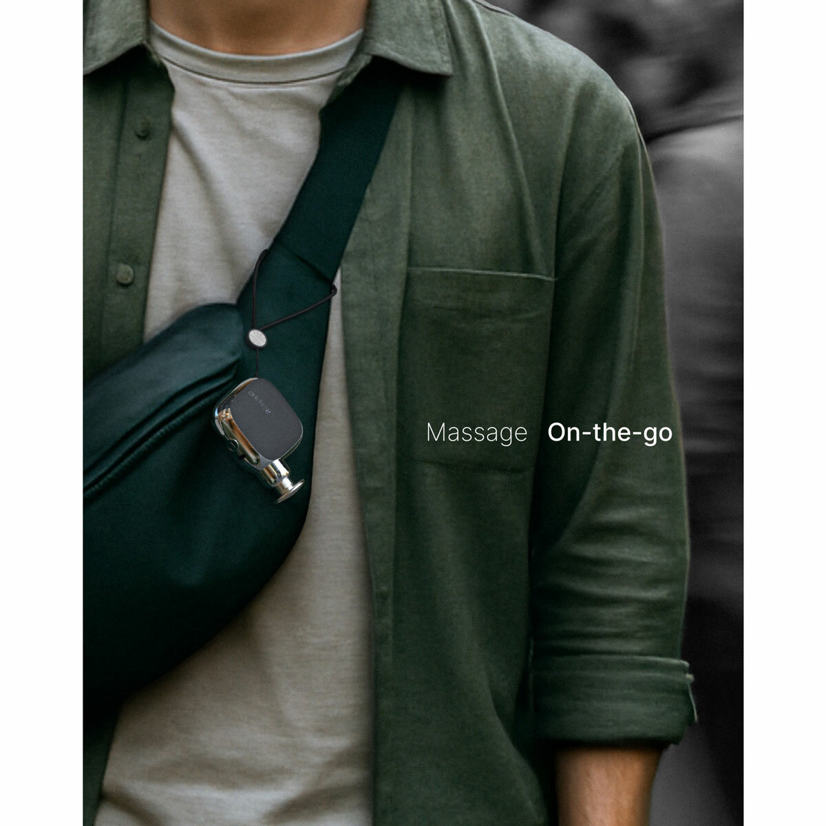 Lifestyle image of Renpho Micro Massage Gun attached to a bag