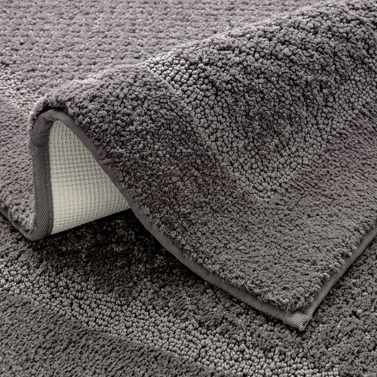 Grey bath mat with a textured surface and non‑slip backing