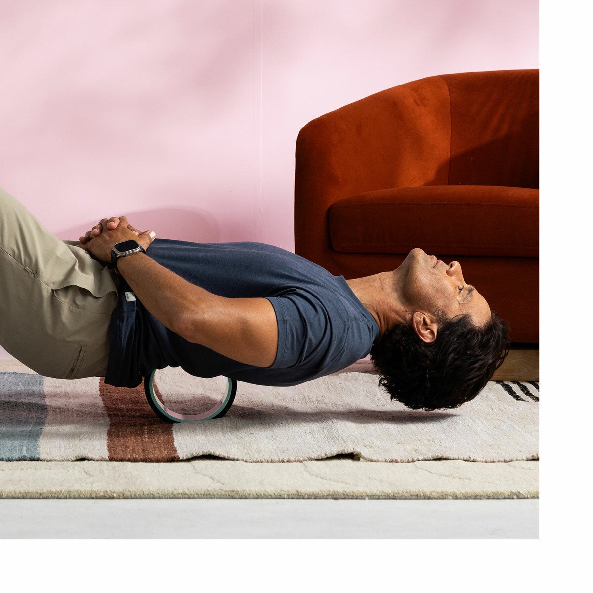 Lifestyle image of a man using a wheel on his back