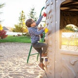 Lifestyle iamge of a child climbing the rock wall Lifestyle iamge of a child climbing the rock wall