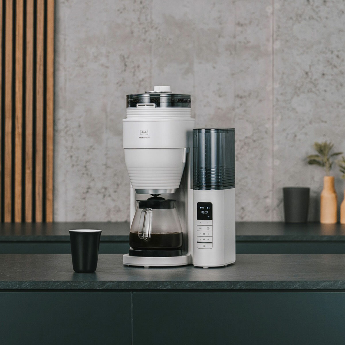 Lifestyle image of Melitta AromaFresh Gind & Brew Coffee Machine on kitchen top