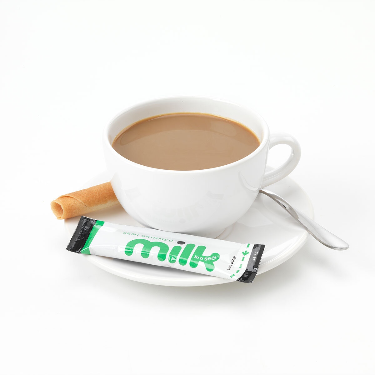 Milk Stick next to a Cup of Tea
