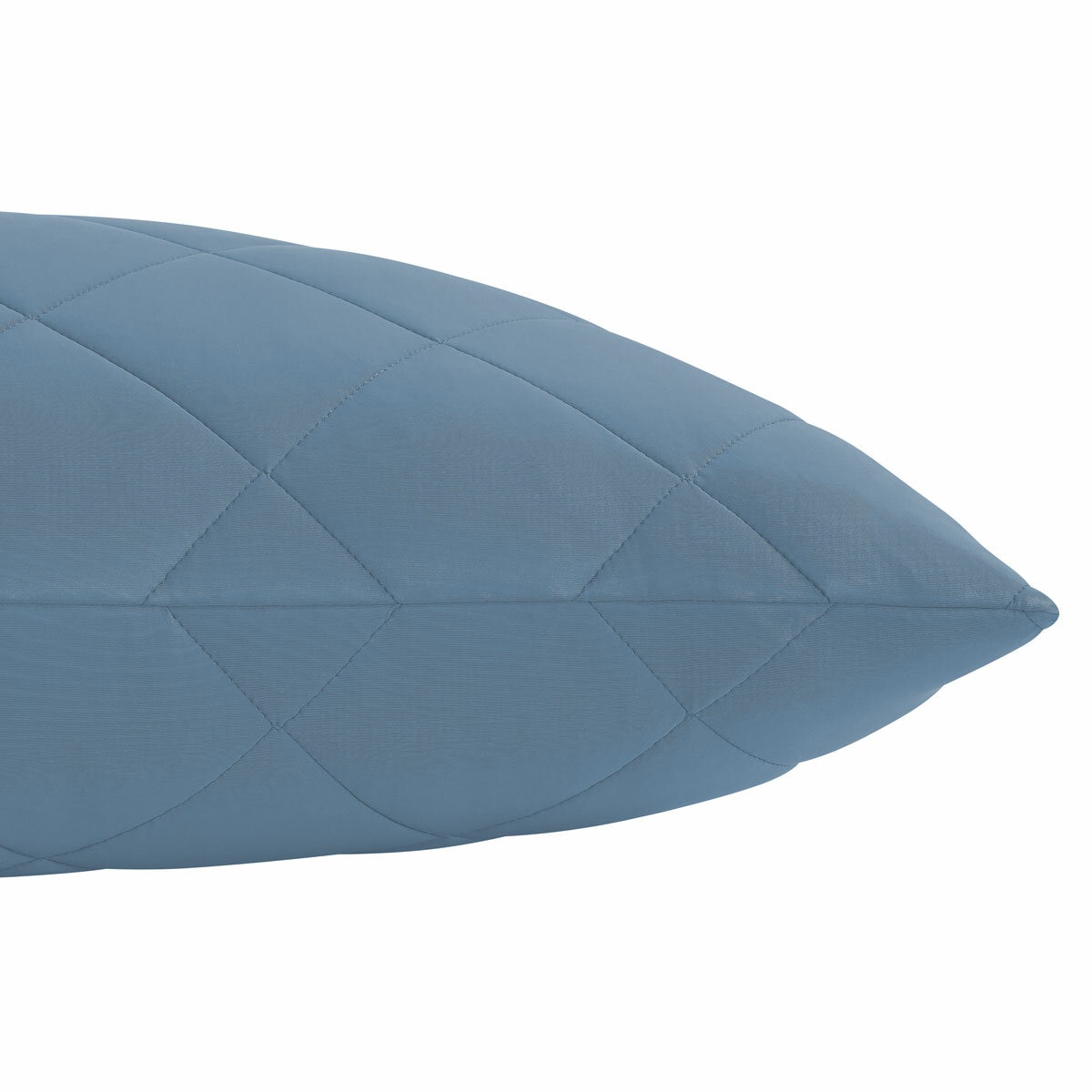 Quilted light blue body pillow with diamond stitching placed in front of two white pillows on a neatly Quilted light blue body pillow with diamond stitching placed in front of two white pillows on a neatly