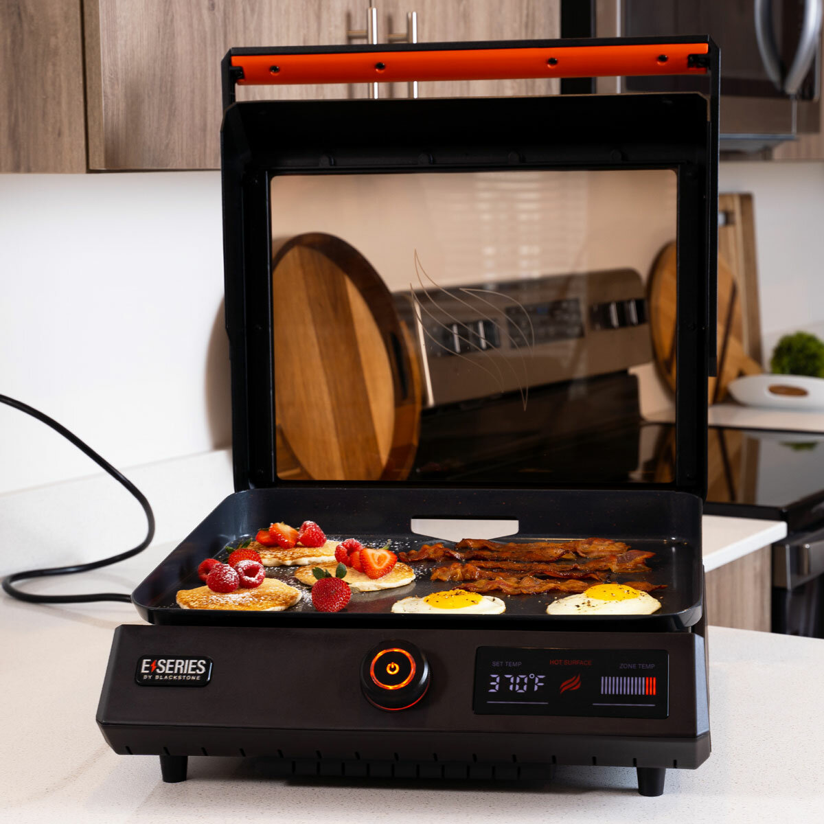 Lifestyle image of Griddle open on a kitchen counter with food Lifestyle image of Griddle open on a kitchen counter with food