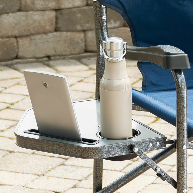 Lifestyle image showing a bottle and device on the side table