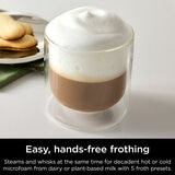 Lifestyle image of  Ninja Luxe Café Pro Espresso Machine showing hands free frothing