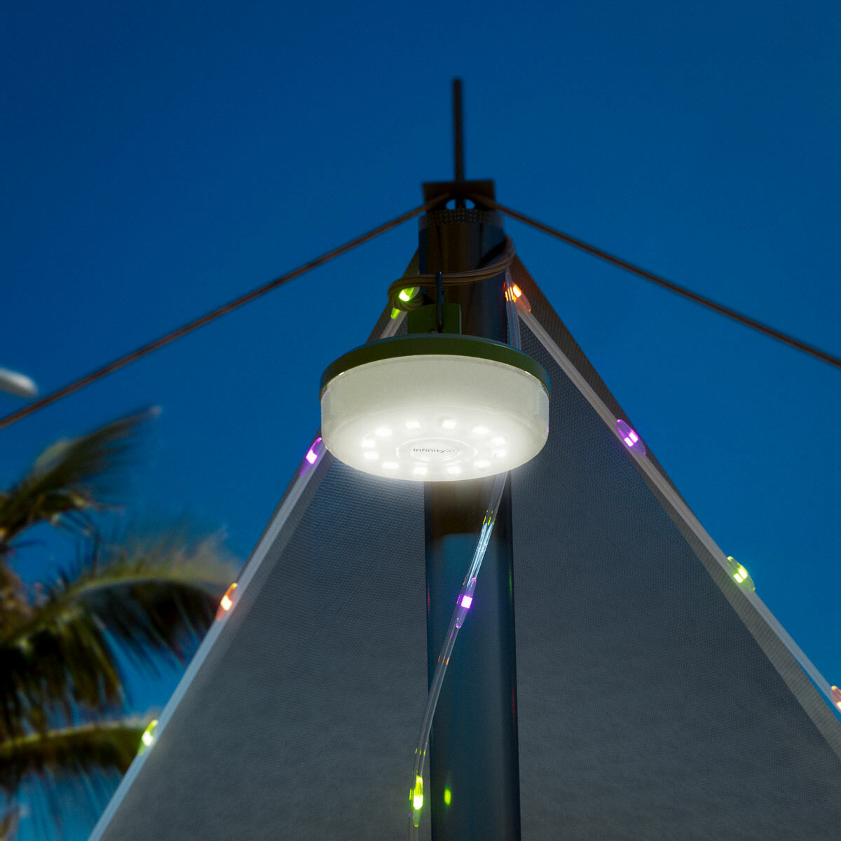 Lifestyle image of the string lights hanging from the top of a tent