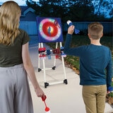 Lifestyle image of two people throwing darts at the LED axe throw board Lifestyle image of two people throwing darts at the LED axe throw board