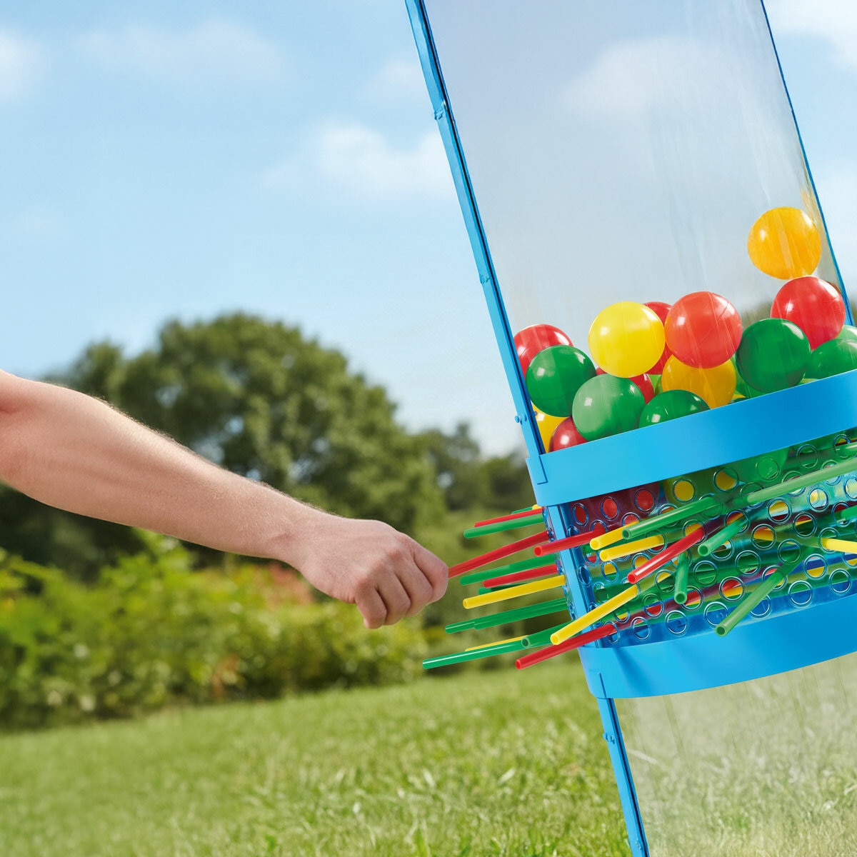 ifestyle image showing someone pulling out a stick from the Ker-Plunk game