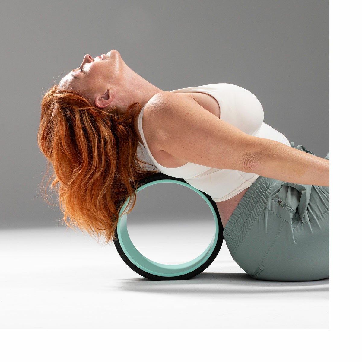 Lifestyle image of a woman using a wheel on her back
