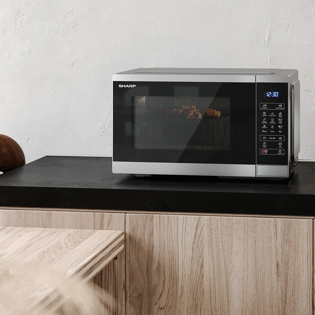 Lifestyle image of Sharp 28 Litre 900W Digital Microwave with 1100W Grill  with grill rack inside