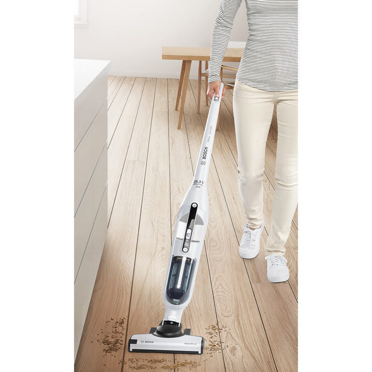 Image of model vaccuming on hard floor