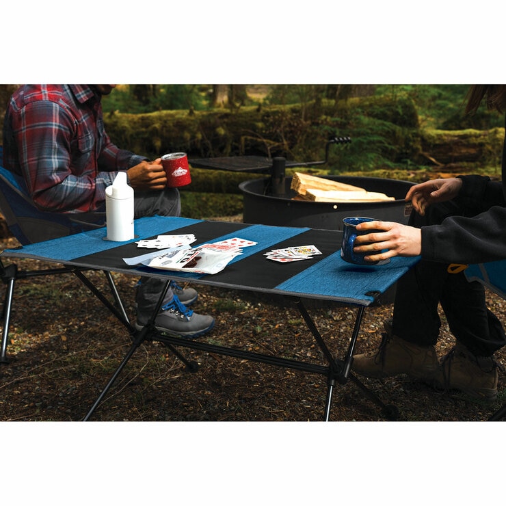 Lifestyle image of two people playing a card game on the table