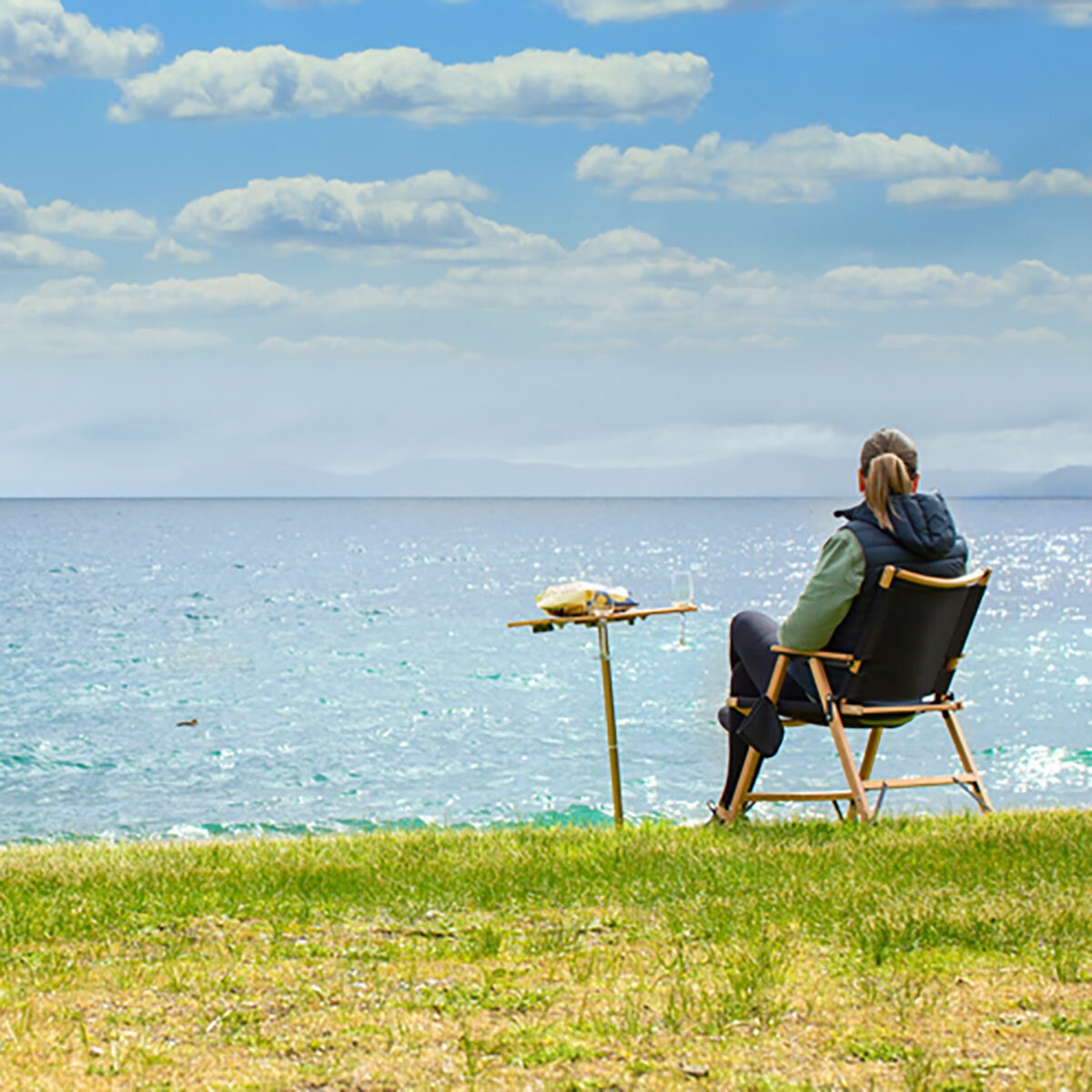 Lifestyle image of someone sat in a chair next to the spike table Lifestyle image of someone sat in a chair next to the spike table