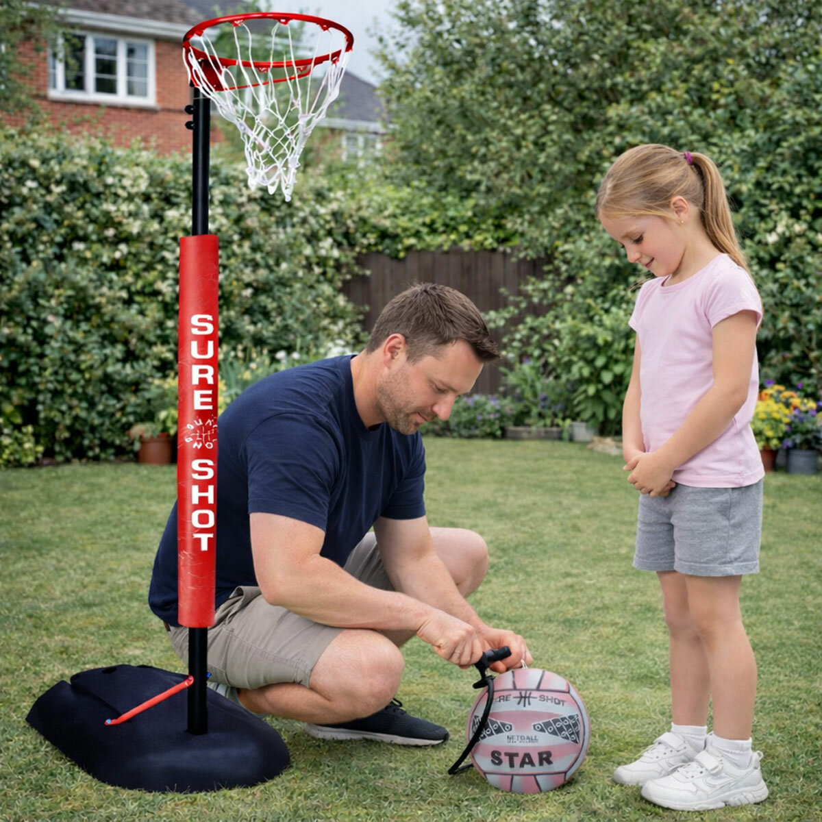 Lifestyle image of a man pumping up the netball