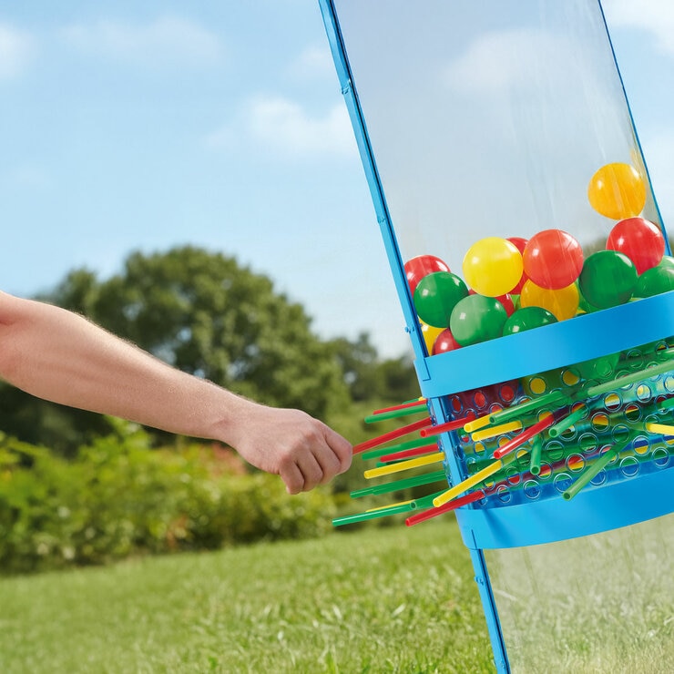 ifestyle image showing someone pulling out a stick from the Ker-Plunk game