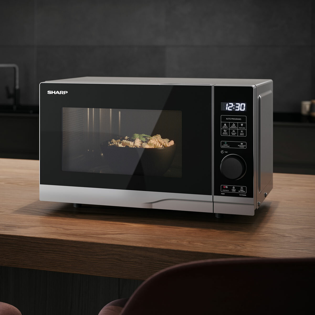 Lifestyle image of Sharp Compact 20 Litre 700W Solo Digital Microwave heating up food Lifestyle image of Sharp Compact 20 Litre 700W Solo Digital Microwave heating up food
