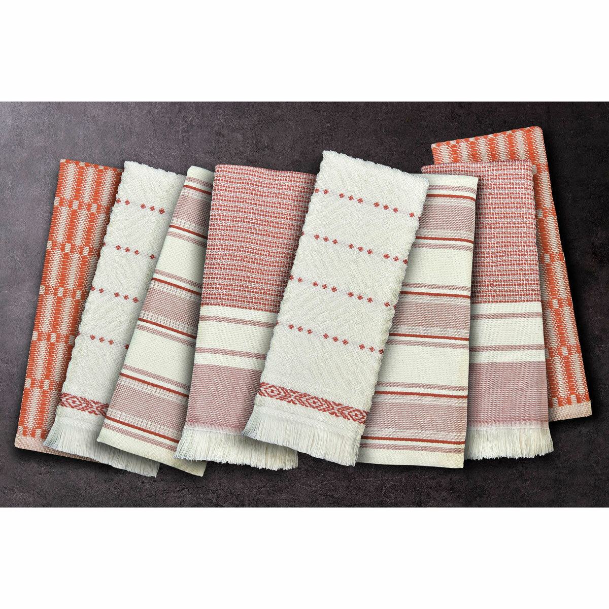 Set of eight folded woven tea towels in red, pink and white stripes and checks, displayed side by side to highlight their varied textures.