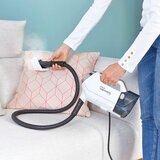 Lifestyle image of the Polti Vaporetta 3 detached and steam cleaning cushions