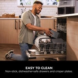Lifestyle image of model putting dishwasher safe parts into a dishwasher Lifestyle image of model putting dishwasher safe parts into a dishwasher