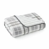 Grey floral throw, folded corner with a plain white background