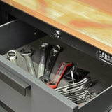 Image of open drawer with tools inside