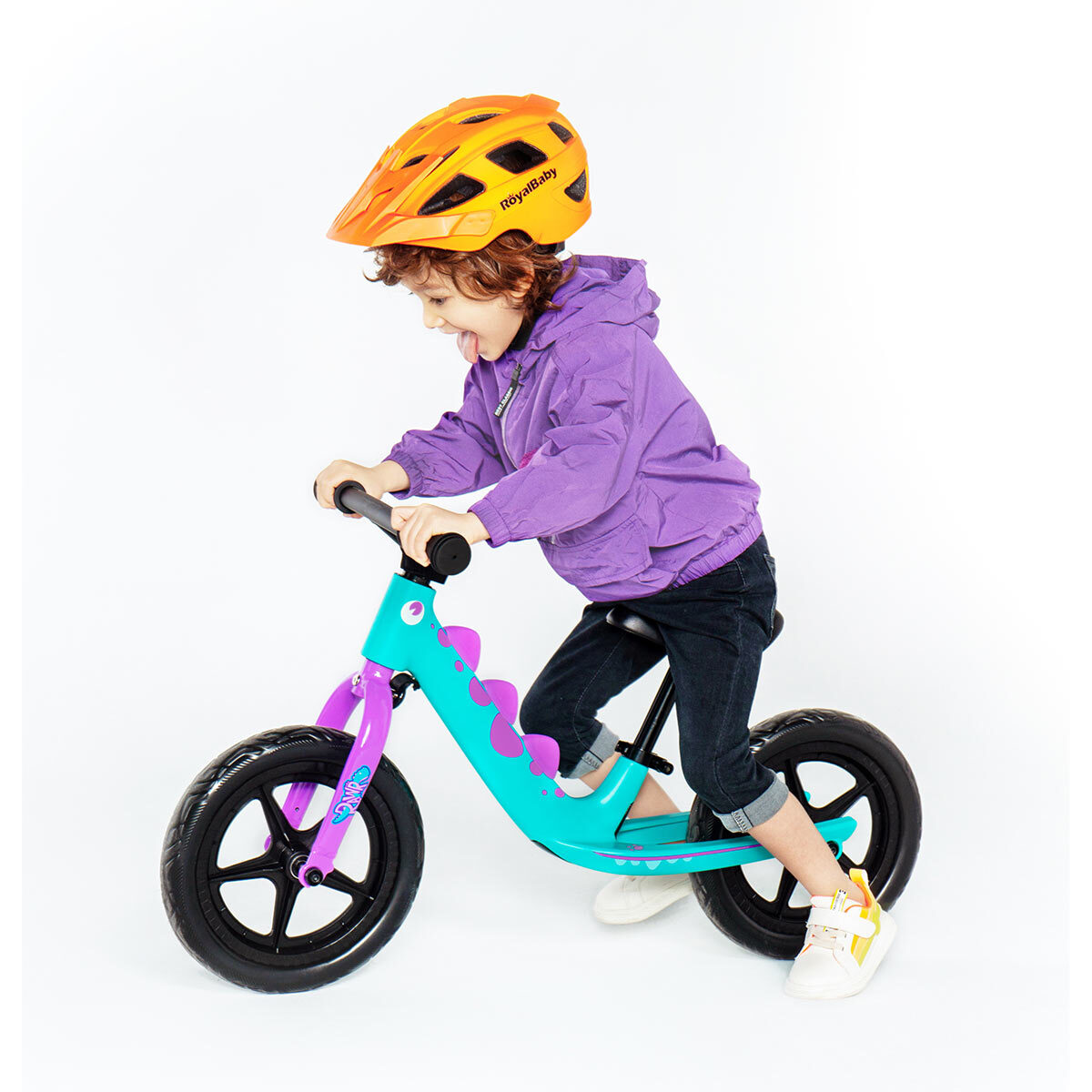 Dino Trike in purple with child riding it