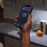Lifestyle image of Delta pro with App on phone