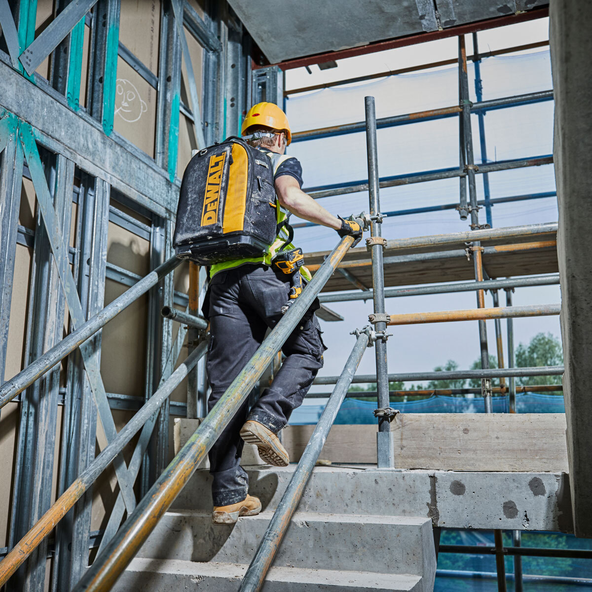 Lifestyle image of backpack beng worn on construction site