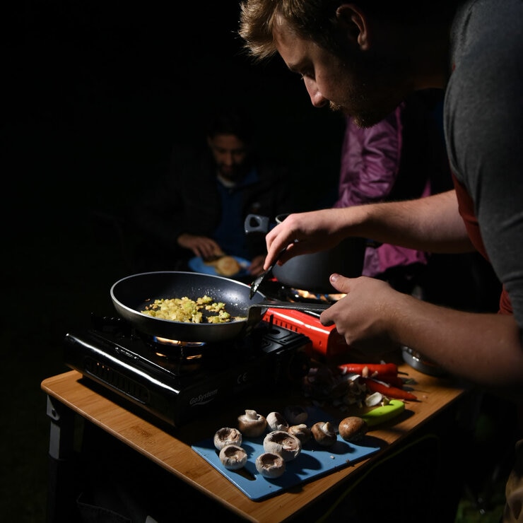Lifestyle image of someone cooking on the stove