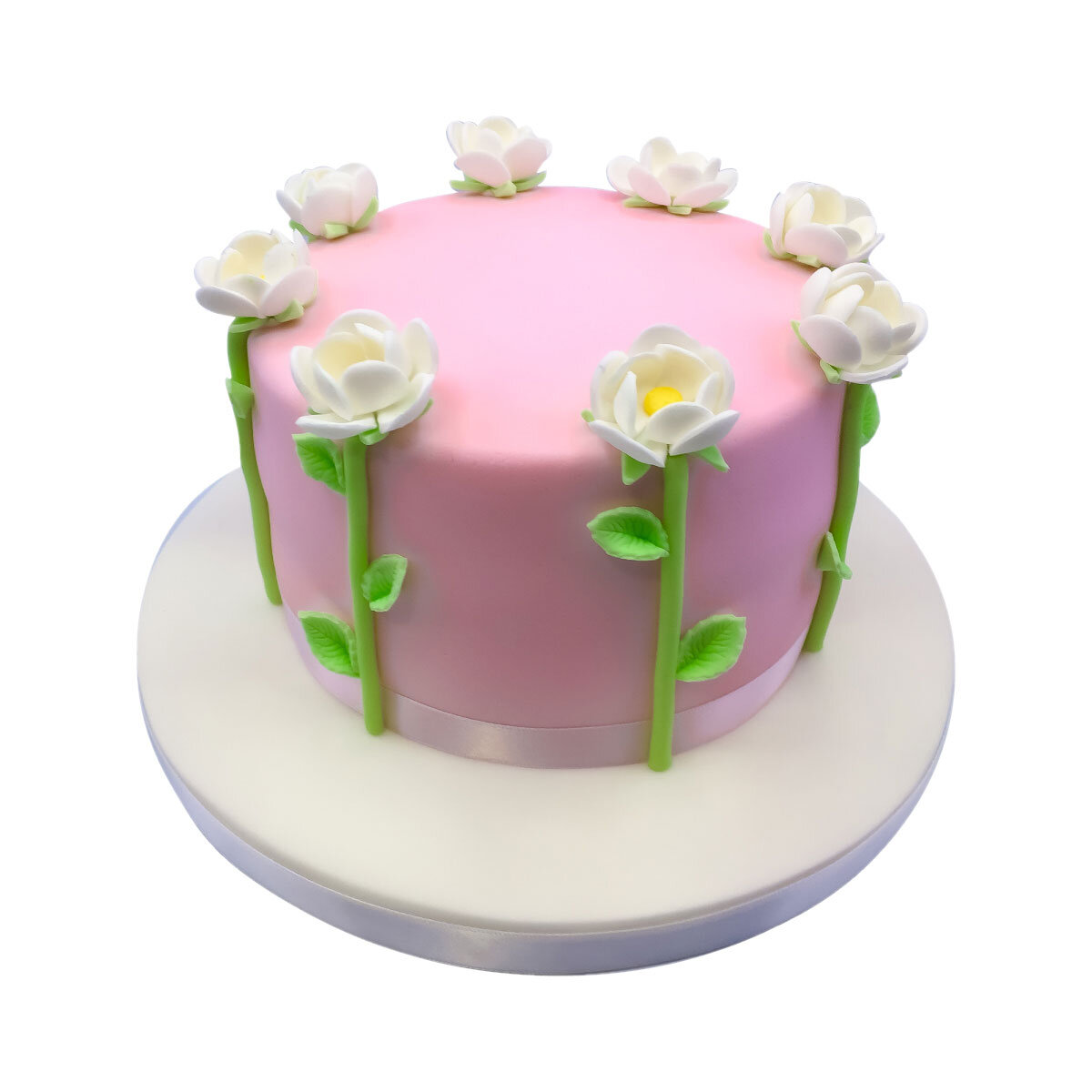 pink cake with white icing flowers and green stems