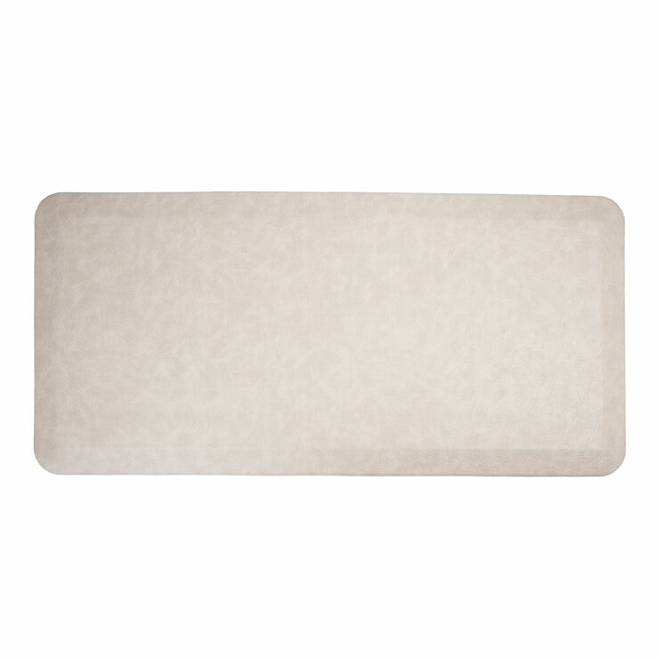 Taupe anti fatigue mat in a white background