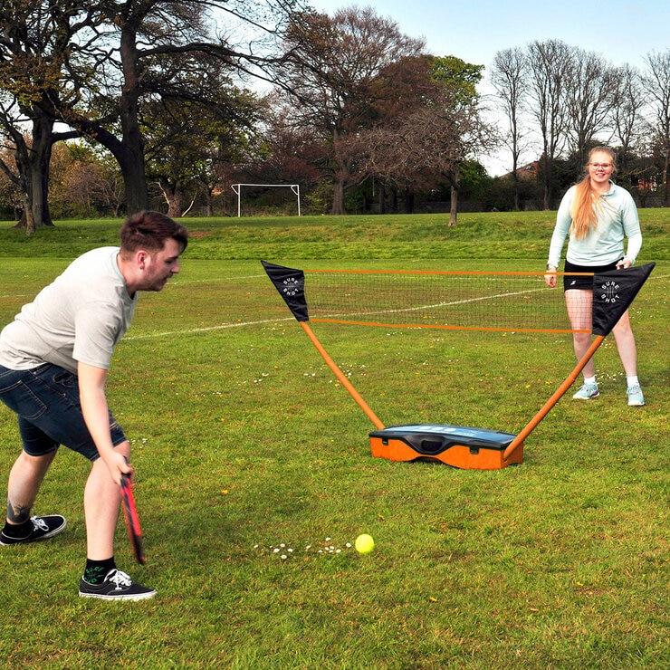 Lifestyle image of two people playing tennis