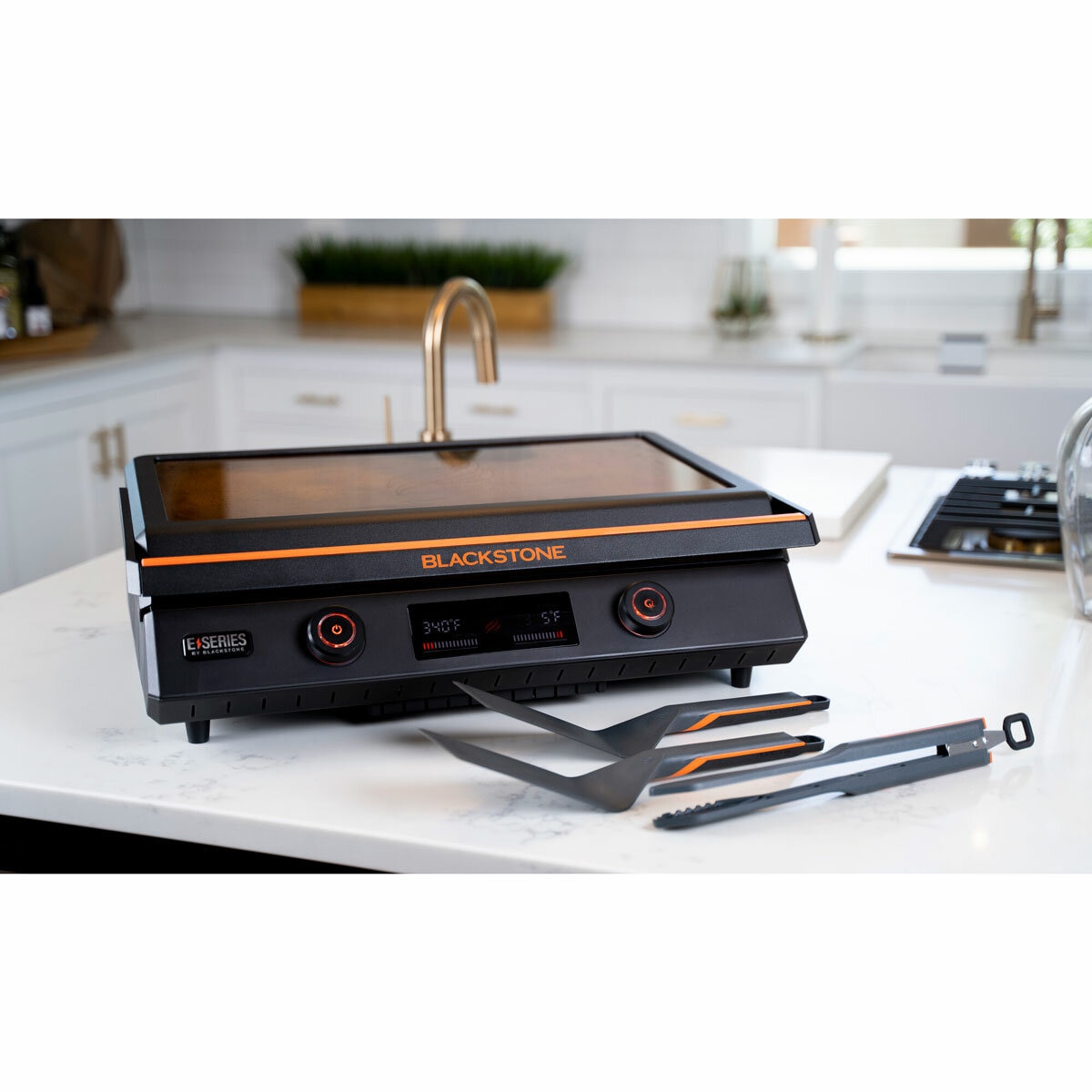 Lifestyle image of electric griddle closed on kitchen counter Lifestyle image of electric griddle closed on kitchen counter