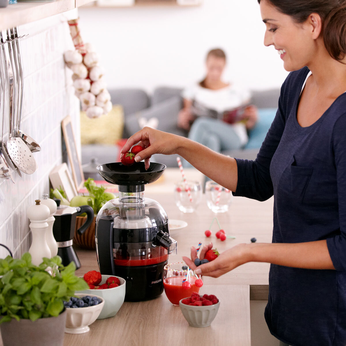 Lifestyle image woman with juicer
