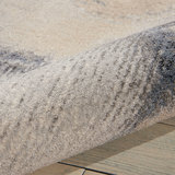 Close up of rolled rug, showing pile depth