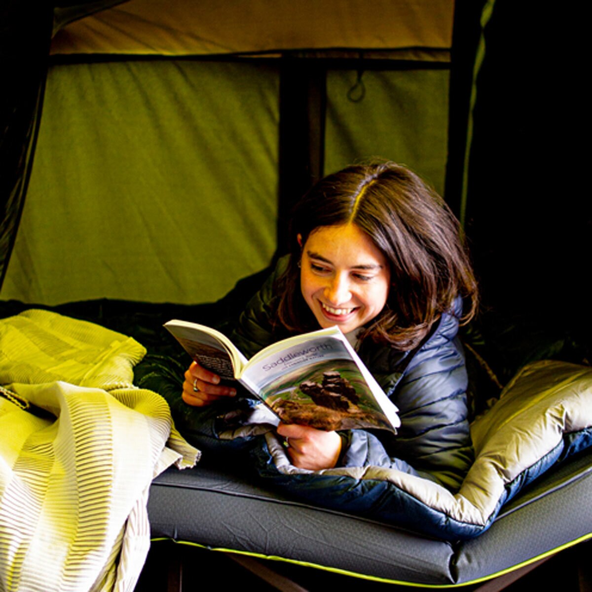 Lifestyle image of a woman laying on the mattress