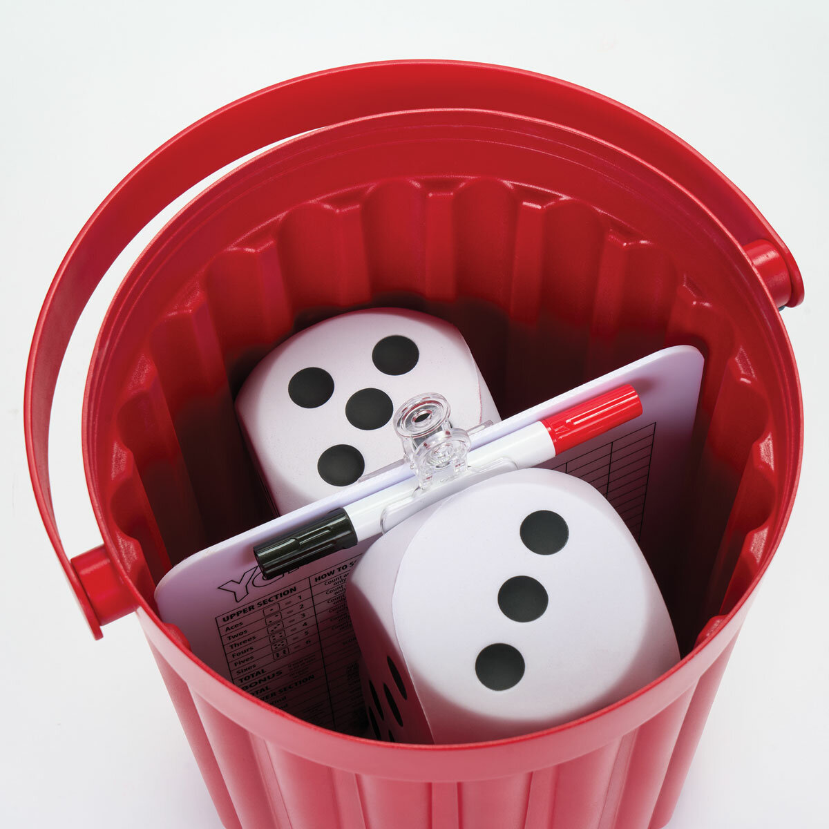 Studio image of the game pieces inside the Giant Yahtzee bucket